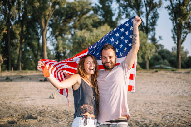 istock Happy couple under stars and stripes flag 1150712722