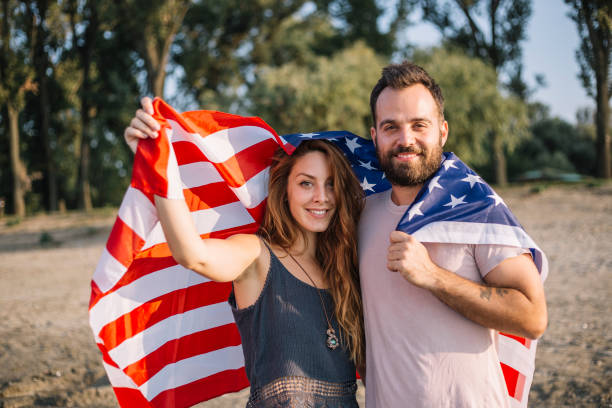istock Happy couple under stars and stripes flag 1150713067