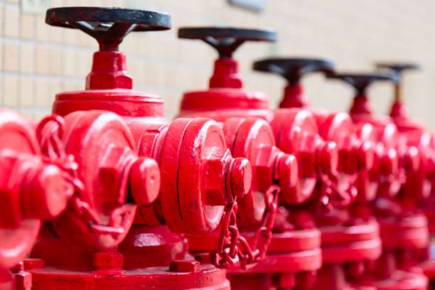 istock A line of red fire hydrants in Guangzhou, China. 1150713114