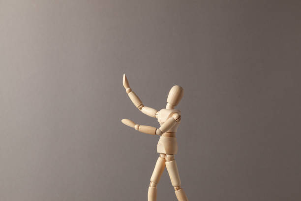 istock Man stretches his hand up on gray background. 1150713257