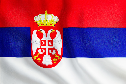 Serbia flag wave close up. Full page Serbia flying flag. Highly detailed realistic 3D rendering.