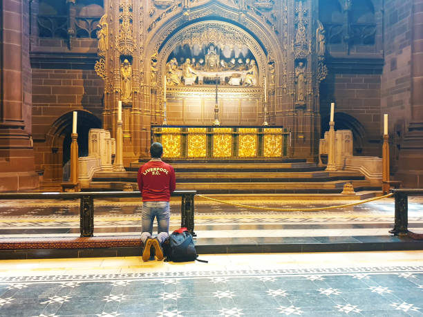 Liverpool fan Liverpool-England,May 11.2019.
Liverpool Cathedral St.James,Liverpool L1 7AZ,England,
The Liverpool fan praying in the Liverpool Cathedral St.James liverpool one stock pictures, royalty-free photos & images