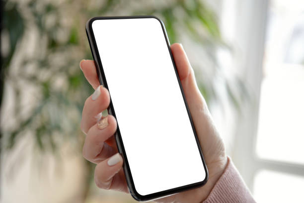 istock female hand holding a phone with an isolated screen 1150714801