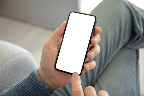 man hand in jeans holding phone with an isolated screen