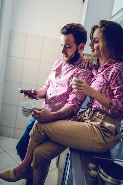 istock Couple Drinking Coffee And Enjoying Social Media 1150719591