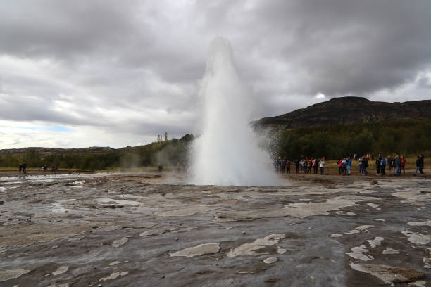 istock People watching the Strokkur eruption. 1150720424
