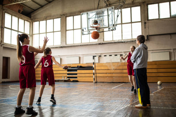 istock Female basketball trainer observing game on training 1150720454