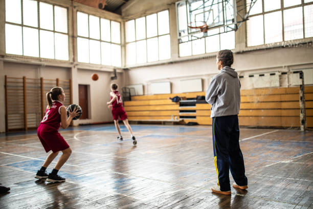 istock Female basketball trainer observing game on training 1150720479