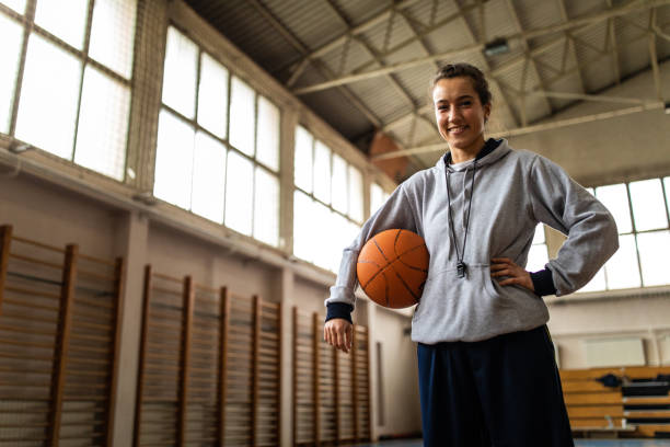 istock Satisfied female trainer in school gym 1150720625