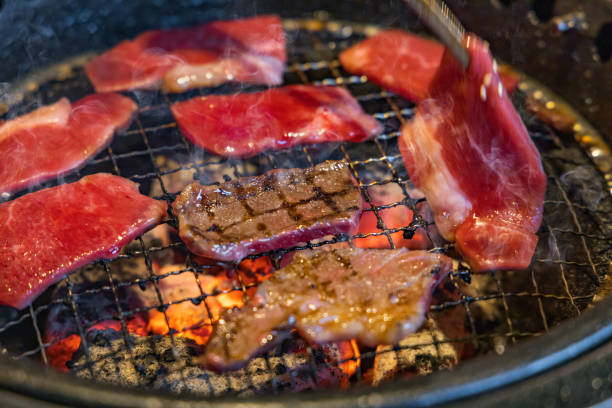 istock Juicy meat grilled on the net 1150720732