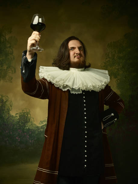 istock Young man as a medieval knight on dark background 1150722496