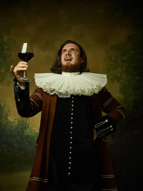 istock Young man as a medieval knight on dark background 1150722501