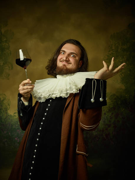 istock Young man as a medieval knight on dark background 1150722502