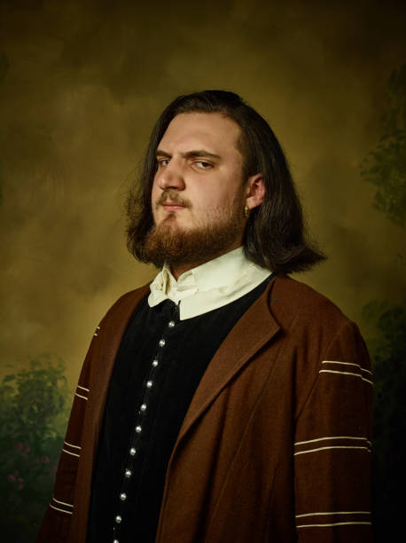 istock Young man as a medieval knight on dark background 1150722507