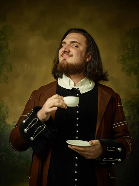 istock Young man as a medieval knight on dark background 1150722514