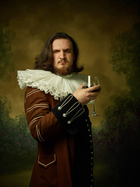 istock Young man as a medieval knight on dark background 1150722517