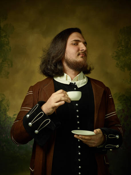 istock Young man as a medieval knight on dark background 1150722530