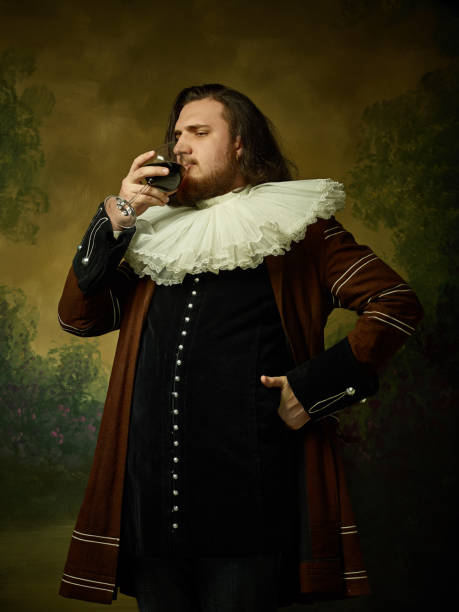istock Young man as a medieval knight on dark background 1150722531