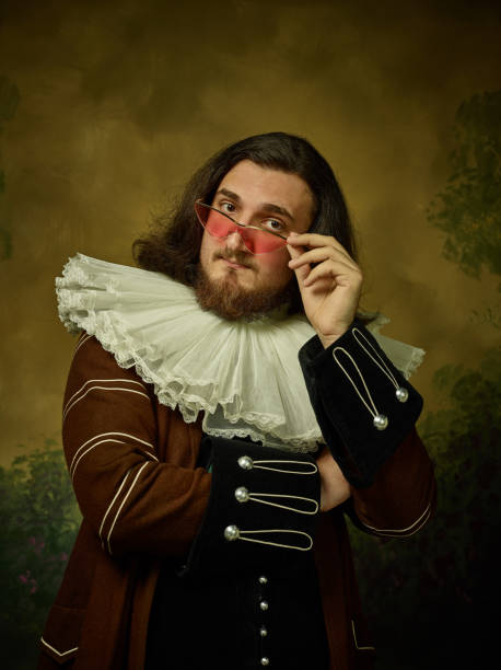 istock Young man as a medieval knight on dark background 1150722548
