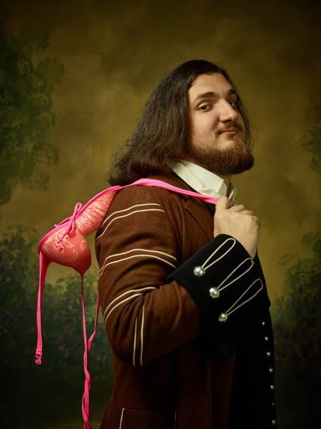 istock Young man as a medieval knight on dark background 1150722550