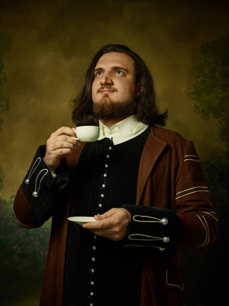 istock Young man as a medieval knight on dark background 1150722551