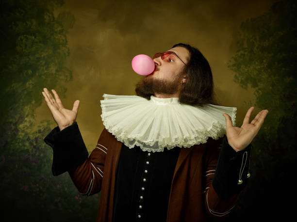 istock Young man as a medieval knight on dark background 1150722552