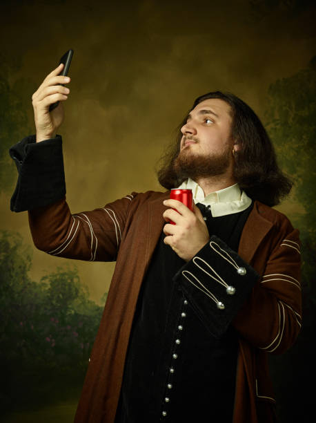istock Young man as a medieval knight on dark background 1150722560