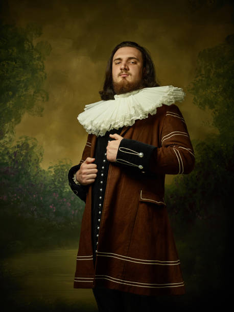 istock Young man as a medieval knight on dark background 1150722581