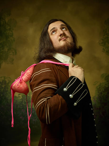 istock Young man as a medieval knight on dark background 1150722586