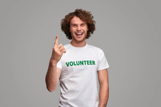istock Cheerful volunteer pointing up 1150722959