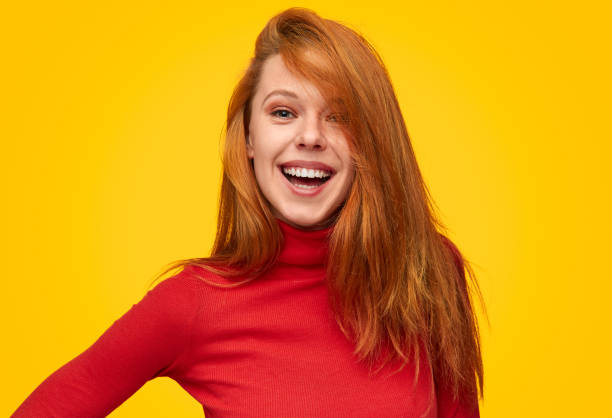 istock Playful flirty girl in red turtleneck 1150723070