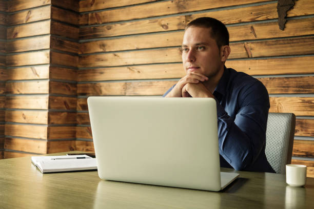 Young psychotherapist doctor working at home in his home office as free online therapy doctor for people who cant afford medical treatment and advice in regular expensive sessions in private practice