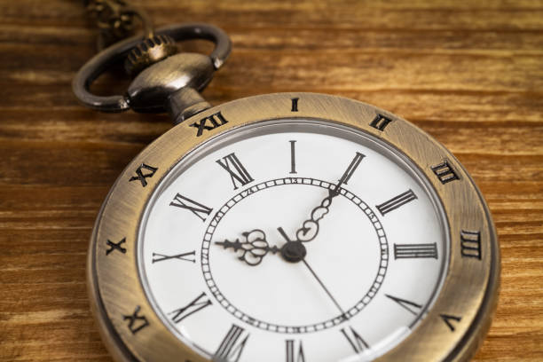 istock Vintage pocket watch clock on wooden background 1150724204