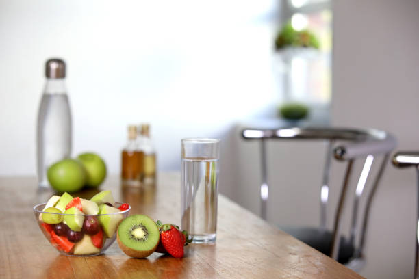 Fruit bowl and a glass of water are in a kitchen