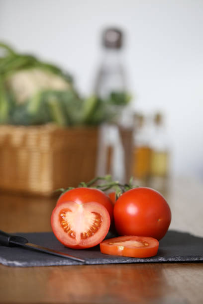 istock Sliced tomatoes lie in the kitchen on a chopping board 1150726980