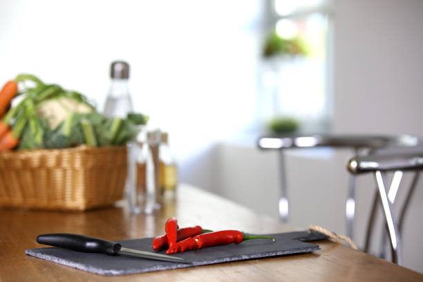 istock Sliced chilli pods on a slate plate in the kitchen 1150727015
