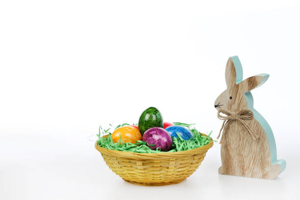istock Easter basket with colourful eggs and wooden Easter bunny 1150727971