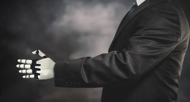 istock business man and cyborg robotic hand 1150729180
