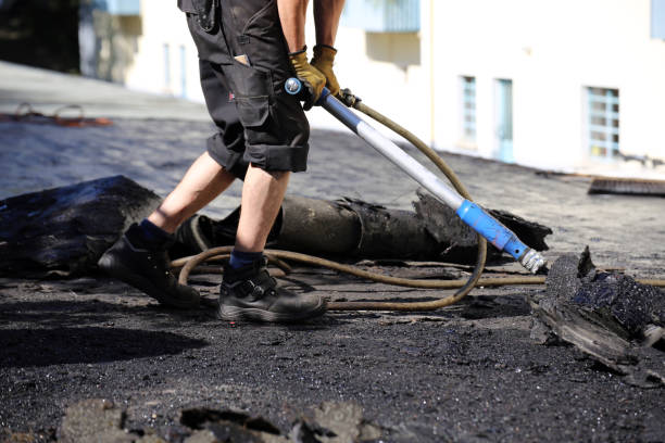 istock Roofers remove old bitumen and roof waterproofing 1150729358