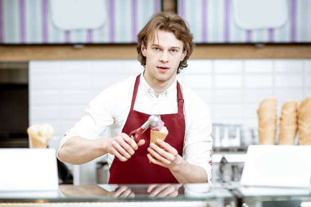 istock Man making ice cream in the shop 1150729391