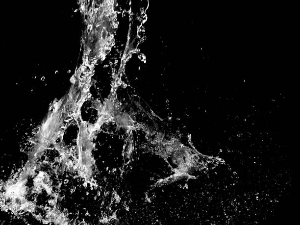 istock Water splashing isolated on a black background 1150730690