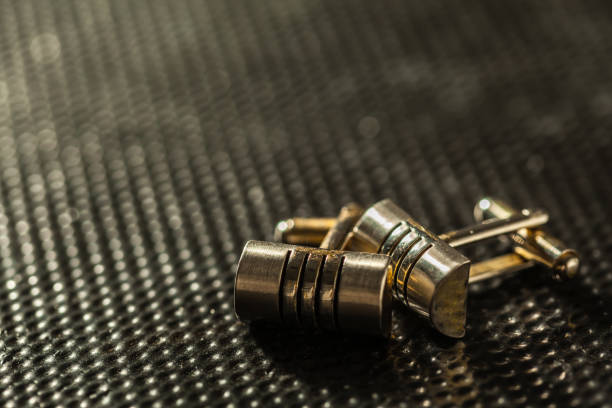 istock A pair of cufflinks on a dark background 1150731093