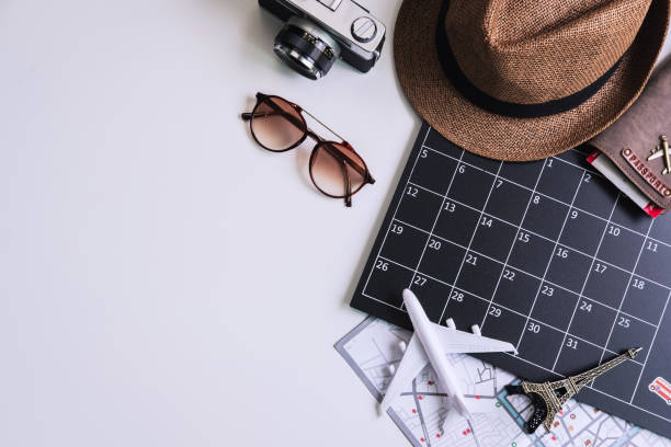 istock Vacation calendar with camera and travel items, Top view 1150731207