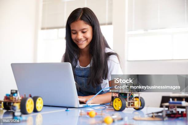 Female Student Building And Programing Robot Vehicle In After School Computer Coding Class Stock Photo - Download Image Now