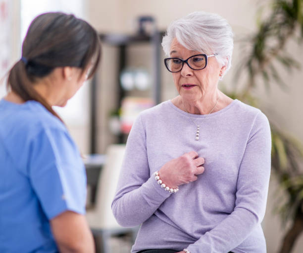 istock Sad senior woman at doctor's office 1150732831