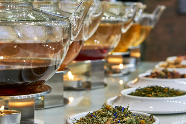 Tee the Different herbal teas in glass jugs taste test stock pictures, royalty-free photos & images