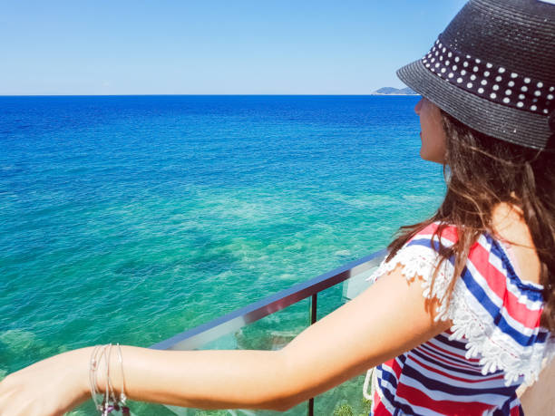 istock Woman at a hotel balcony 1150736601