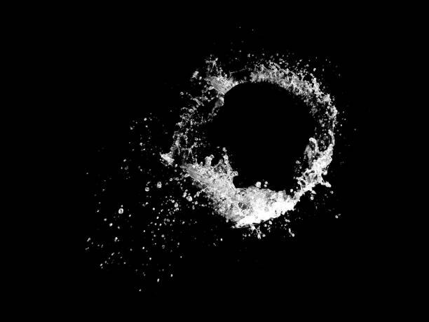 Water splashing isolated over a black background