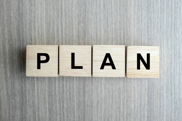 istock wooden cube with PLAN text on table background. goal, success, strategy, solution and business concepts 1150737095
