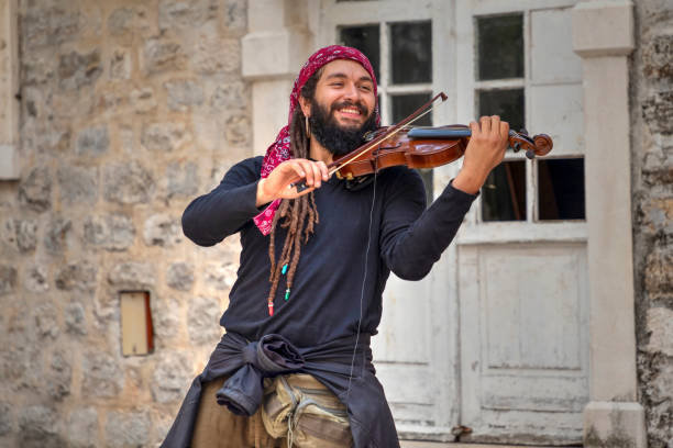 Violinist Abdul Medina performing in the Old Town of Budva stock photo